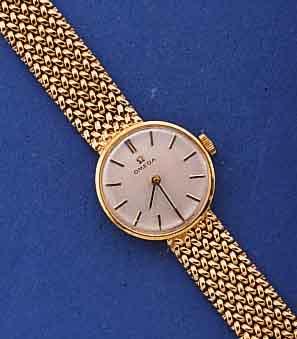 OMEGA DAMENGOLDBANDUHR, SCHWEIZ UM 1967, GG 750/000-RUNDGEH. INCL. SPÄTER ANGES. NEUTR. GG 585/000-FLECHTB., BODEN GEDR., VERS. BLATT, RUNDANKERW. ...
