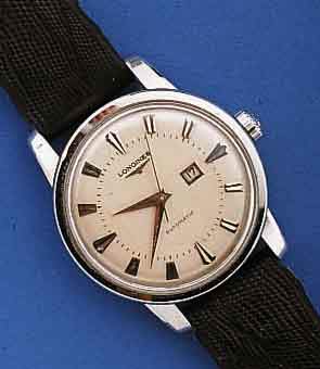 LONGINES HERRENARMBANDUHR AUTOMATIK, SCHWEIZ UM 1957, EDELST., BODEN GESCHR., VERS. BLATT, M. AUFGES. WG-STD.-ZEICHEN, WG-ZEIGER, LEDER- B. ...