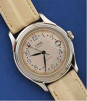 ORIS HERRENARMBANDUHR, AUTOMATIK, SCHWEIZ UM 1996, EDELST.-BOD. GESCHR., GUILL. U. VERS. KONTRASTZIFFERBL., DAT., 25 ST., ZENTRALROT. ...