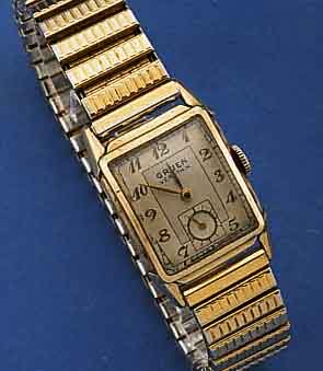 GRUEN VERY THIN HERRENARMBANDUHR, SCHWEIZ/US UM 1952, RECT. GEH. M. GG-AUFL., EDELST.-BOD. GEDR., METALLZUGGLIEDERBD. M. GG-AUFL. ZEIT- IDENT., ...