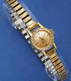 OMEGA DAMENARMBANDUHR, LADYMATIC, SCHWEIZ UM 1964, METALL, GG-AUFLAGE, BOD. AUFGEDR., ZEIT- IDENT. ZUGGLIEDERBD. M. GG-AUFL., VERS. BL., AUFGES. ...