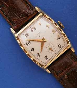 ELGIN HERRENARMBANDUHR, USA UM 1952, METALL GG-AUFL., TONNENFORM, EDELST.-BOD. AUFGEDR., KL. SEK. TEILVERT., RUNDANKERWERK, 17 ST., HANDAUFZUG, ...
