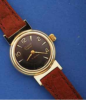 GLASHÜTTE DAMENARMBANDUHR, DEUTSCHLAND UM 1991, BEZ. ORIGINAL, METALL HART VERG., BE- WEGL. BANDANSTÖßE, EDELST.-BOD. AUFGEDR., ...