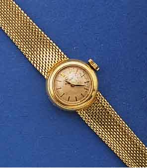 OMEGA DAMENGOLDBANDUHR, SCHWEIZ UM 1960, GG 750/000 GEH. INCL. GG-ORIG.-BD., VERS. BL., ALTERSBED. FARBL. GET., AUFGESETZTE GOLDSTD.- ZEICHEN, ...