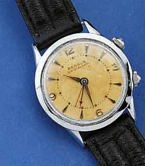 BENRUS ARMBANDWECKER, SCHWEIZ/USA UM 1955, METALL HART VERCHR., STÜLPAUSF., EDELST.BOD., GET. A-WELLEN, BEI FERTIGST. WASSERGESCH., BENRUS-ETUI ...