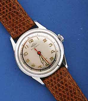 MASCOT HERRENARMBANDUHR AUTOMATIK, UNGETR. LAGERW. UM 1956, FÜR DEN BRIT. MARKT IN AN- LEHNUNG AN DAS PFERDERENNEN, HIER M. HUFEISEN- AUFDR., ...