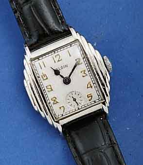 ELGIN HERRENARMBANDUHR, USA UM 1930, METALL- GEH. NACHVERCHR., BOD. AUFGEDR., BL. REST., KL. SEK. TEILW. VERTIEFT, RUNDANKERWERK, 7 ST. , VERN., ...