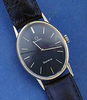 OMEGA ARMBANDUHR, GENEVE, SCHWEIZ UM 1974, METALL, 20 MICRON WG-AUFL., EDELST.-BOD. AUF- GEDR., HANDAUFZUG, VERG. ANKERWERK, KAL. 620, RINGUNR., ...