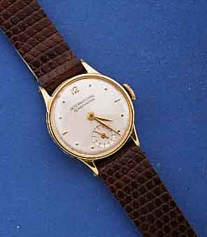 IWC DAMENARMBANDUHR, SCHWEIZ UM 1946, GG 750 /000, BOD. U. GLASRAND AUFGEDR., BL. REST., KL. SEK. TEILVERT., BRÜCKENANKERWERK, 15 ST., ...