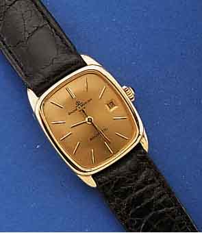 BAUME & MERCIER ARMBANDUHR, BAUMATIC, SCHWEIZ UM 1972, GG 750/000, MINERALFLACHGL., BOD. AUFGEDR., SCHMUCKKRONE, VERG. BL., LT. FLECKIG MIT LUPE ...