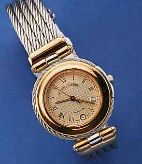 PHILIPPE CHARRIOL DAMENARMBANDUHR, SCHWEIZ UM 1990, GEH. AUßEN SOWIE 5-REIHIGES BD. AUS GEDREHTEM STAHL, LÜN. U. BANDANST. ROSE VERG., ...