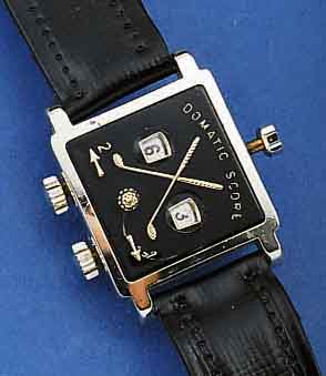 GOLFZÄHLER IN FORM EINER ARMBANDUHR, BEZ. DOMATIC SCORE, SCHWEIZ NACH US-PATENT UM 1956, METALL ELOX., ORIG. BAND, LT. LAGER- U. NUTZSP.