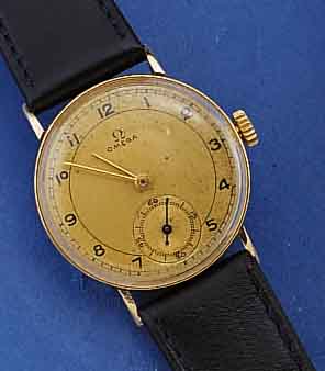 OMEGA HERRENGOLDUHR, SCHWEIZ UM 1937, GG 585/000, BOD. U. GLASRAND AUFGEDR., D. CA. 30 MM, 2-FARB. VERG. ORIG. BL. FLECKIG, BAND NEUTR. NEU, 15 ...