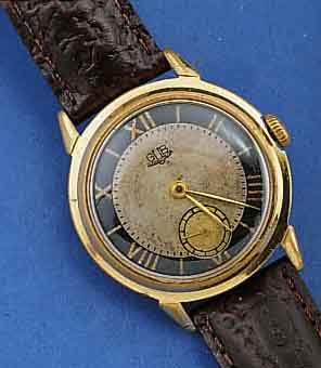 GLASHÜTTE HERRENARMBANDUHR, FRÜHE AUSFÜHRUNG, KAL. 60, DEUTSCHLAND UM 1953, METALL, GG-AUFLAGE, 2-FARB. BL. FLECKIG, BER., EDELST.-BOD. GESCHR., ...