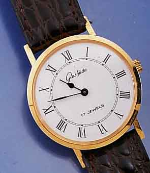 GLASHÜTTE HERRENARMBANDUHR, DEUTSCHLAND UM 1984, METALL HARTVERG., EDELST.-BODEN GEDR., EMAILFARB. KONTRASTZIFFERBL., LEDERB., NEUTR. ETUI, ...