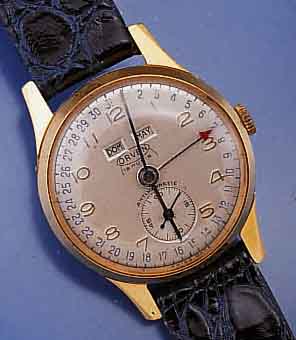 ORVEN/BRITIX WATCH CO. ARMBANDUHR MIT VOLL- KALENDERANZEIGE AUßER MONDPHASE, MEDIUMGR., D. CA. 31 MM, SCHWEIZ UM 1952, METALL HARTVER- G., ...