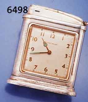 PHINNEY-WALKER GROßES BENZINFEUERZEUG MIT INTEGRIERTER UHR, ENGLAND UM 1946, METALL VERS., ALTERSBED. BER., 1-TAGE-WERK M. STIFT- ENANKERG., ...
