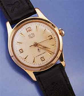 GLASHÜTTE HERRENARMBANDUHR, DEUTSCHLAND UM 1958, METALL VERG., ALTERSBED. GER. NUTZSP., EDELST.-BODEN GESCHR., BLATT M. GÜTEZEICHEN WOHL ...