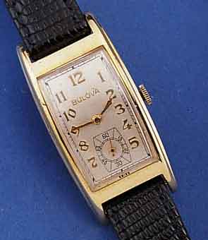 BULOVA HERRENARMBANDUHR, USA UM 1939, GG- FILLED, TONNENFORM GEZOGEN, IN SICH GEW., BODEN GEDR., MAßE CA. 23 X 21 MM, VERS. BLATT, FORMANKERW., ...