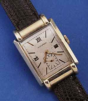 MOVADO HERRENARMBANDUHR, SCHWEIZ UM 1934, NICKELGEH. M. AUFGEDR. EDELST.-BOD., BL. REST. (LT. FLECKIG), FORMANKERW., KAL. 375, 17 ST., INDIR. KL. ...