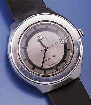 OMEGA HERRENARMBANDUHR AUTOMATIK GENEVE, SEL TEN, EDELST., BODEN GESCHR., SCHWEIZ UM 1974, LÜNETTE BEIDS. DREHB./BER., 2-TEIL. GEST. BLATT, ...