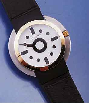 TISSOT DESIGNERHERRENARMBANDUHR SOTTSASS, SCHWEIZ UNGETR. LAGERW. UM 1988, EDELST. MATT. GOLDLÜNETTE, BOMB. SAPHIRGL., KONTRASTZIFFER- BL., ...
