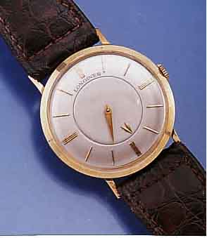 LONGINES HERRENARMBANDUHR, SCHWEIZ/USA UM 1960, GG-FILLED, GLASR. GEDR., MYSTERIEUSE ZEITANZ., STD. HIER DURCH ZEIGERSCHEIBE, BLATT REST., ...