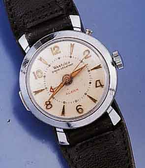 WESTCLOX ARMBANDWECKER, USA/DEUTSCHLAND UM 1950, METALL VERCHR., EDELSTAHLBOD. AUFGEDR., WECKZEIT EINSTELLB. DURCH DRÜCKER AUßEN 2, STOPP AUF ON ...