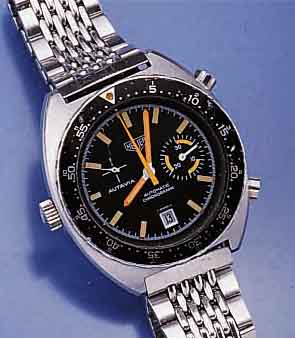 HEUER ARMBANDCHRONOGRAPH AUTAVIA, SCHWEIZ UM 1970, MASSIV EDELST., EDELST.-BAND, AUTOMATIK M. 30-MIN.-STOPPZÄHLER, ZUR BESSEREN STOPP- BED. KRONE ...