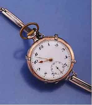 ETERNA DAMENTASCHEN/ANHÄNGEUHR HIER ALS ARM- BANDUHR IM VERSILBERTEN METALLBAND MIT HALTE- KLAMMER, SCHWEIZ UM 1914, 800ER SILBER, RÄNDER VERG., ...