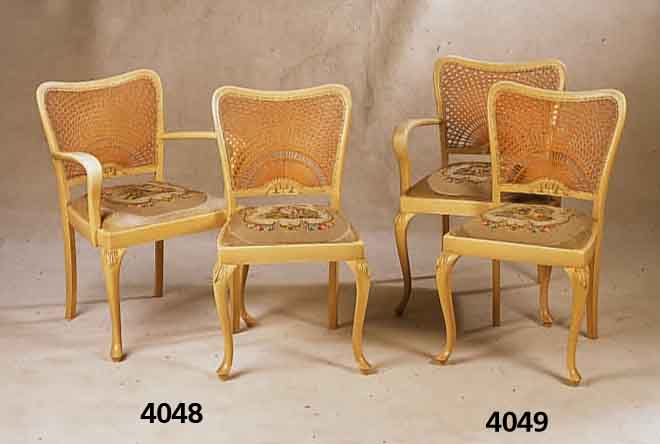 4 StÜhle, deutsch, um 1970, Schlingmann, Buche massiv, Schnitzereien aus dem Vollholz, RÜcken mit Rohrgeflecht, Sitze mit Gobelinbe- zug, ...