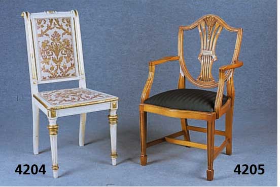 4 Armlehnsessel, deutsch, um 1970/80, Nuß- baum massiv, im Sheratonstil, versprosst, 4- fach gefieft, RÜckenlehne in Schildform, Gar- ...