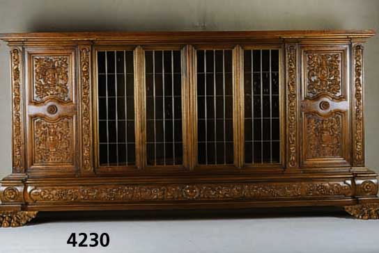 PrunkbÜcherschrank, deutsch, um 1960/65, Warrings, Modell Roland, Korpus Weichholz, Buche und Nußbaum massiv, Front mit reicher Bildhauerarbeit ...