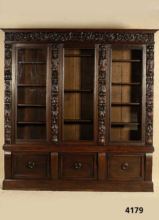 BÜcherschrank, Niederlande, um 1900, Renaissancestil, Eiche massiv, Lisenen und Kopf reich geschnitzt, aufgesetzte BlÜten, FrÜchte und ...