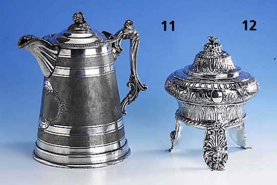 Bonbonniere, deutsch um 1850/60, 13-lÖtig, auf 3 hohen FÜßen stehend, Putten- kopfdekor, reich floral verziert, ca. 685 g, H. ca. 25 cm, ...