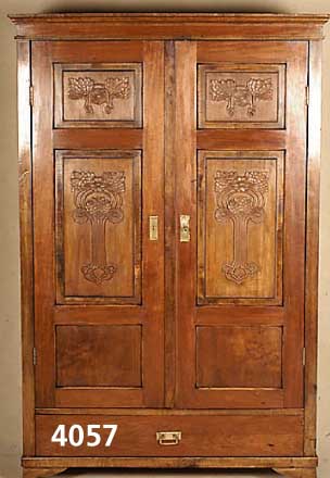 Schrank, wohl deutsch, um 1920, Nußbaum furniert, zweitÜrig, TÜren mit Schnitzereien versehen, Alters- und GebrauchsschÄden, ca. 183x120x48 cm