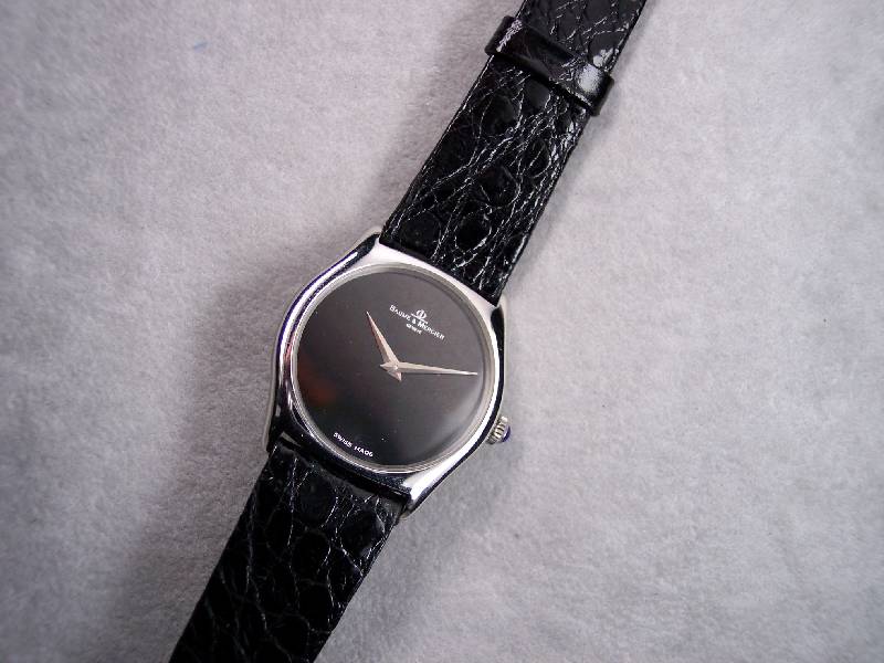 BAUME & MERCIER Armbanduhr, Schweiz wohl ungetr. Lagerw. um 1985, Edelst. pol., Mineralflachglas, Boden aufgedr., verg. Rundankerw., 17 St., ...