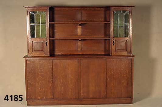 BÜcherschrank, deutsch, um 1910, Korpus Weichholz, Eichefurnier, im Oberteil mit Blei- verglasung, ca. 180x200x42 cm