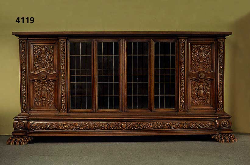 PrunkbÜcherschrank, deutsch, um 1960/65, Warrings, Modell Roland, Korpus Weichholz, Buche und Nußbaum massiv, Front mit reicher Bildhauerarbeit ...