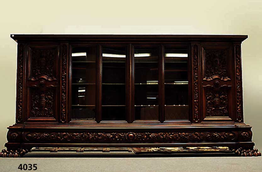 PrunkbÜcherschrank, deutsch, um 1960/65, Warrings, Modell Roland, Korpus Weichholz, Buche und Nußbaum massiv, Front mit reicher Bildhauerarbeit ...