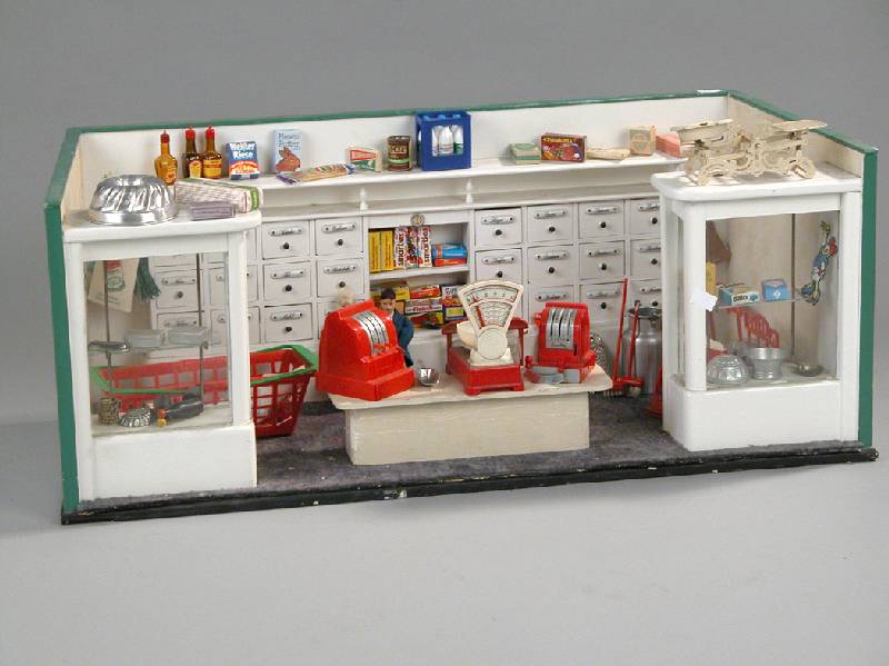 Großer Kaufladen, deutsch, um 1930, mit ZubehÖr, diese z.T. spÄter, wie z. B. große Schrankwand mit 24 Schubladen mit beschrifteten ...