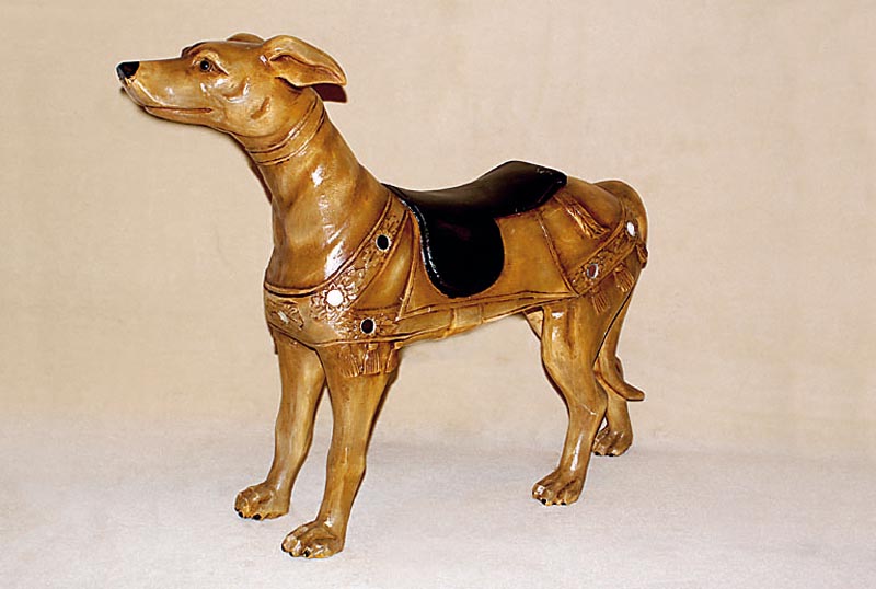Ausgefallene Karruselfigur, Windhund, 2. HÄlfte 20. Jh., Holz, geschnitzt, bunt gefasst, l. Gebr.-Spuren, H. ca. 67 cm