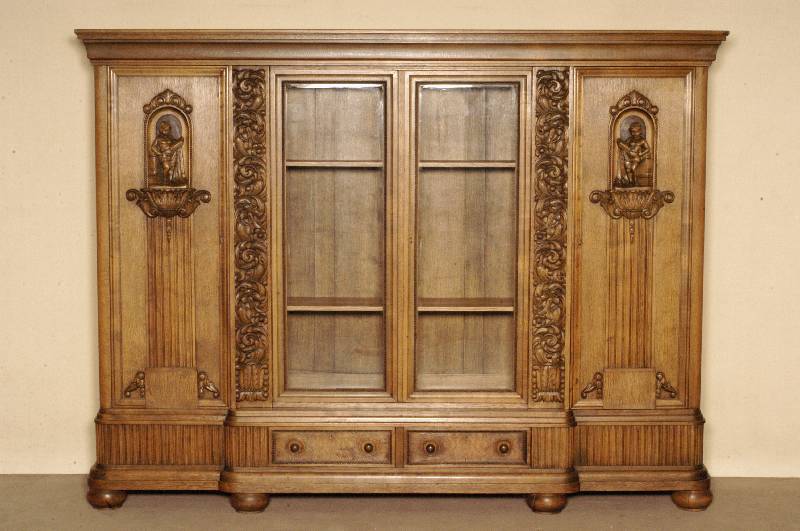 BÜcherschrank, deutsch, um 1910, Korpus Weichholz, Eiche massiv, Eichefurnier, auf KugelfÜßen, Unterteil gerillt, 2-schÜbig, Front mit ...