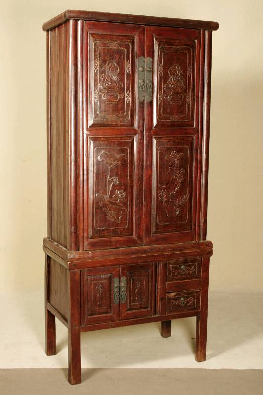 Schrank, Asien, um 1900, Obstholz massiv, rötlich gebeizt, 2-teiliger Korpus, Unterteil auf eckigen Hochbeinen, zwei Türen und zwei Schubladen, ...