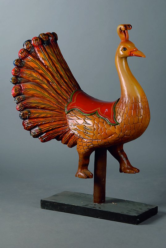 Karusselpfau, ca. 30 Jahre alt, ca. 110x75x55 cm, Holz gefaßt, Altersspuren schwundrissig