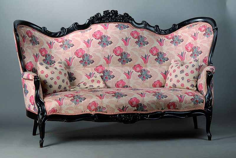 Sofa, deutsch, um 1880, schwarz gefasst, allseitig geschweift, reiche Blätter und Blütenschnitzereien, Polsterung und Bezug erneuert, teils st. ...