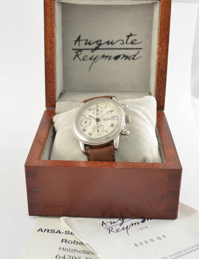 Detail d: AUGUSTE REYMOND Automatik-Chronograph, Schweiz um 1990, 2-teiliges Stahlgeh. mit Glasboden, gedr., runde Drücker, vers. Strukturziff. mit röm. ...