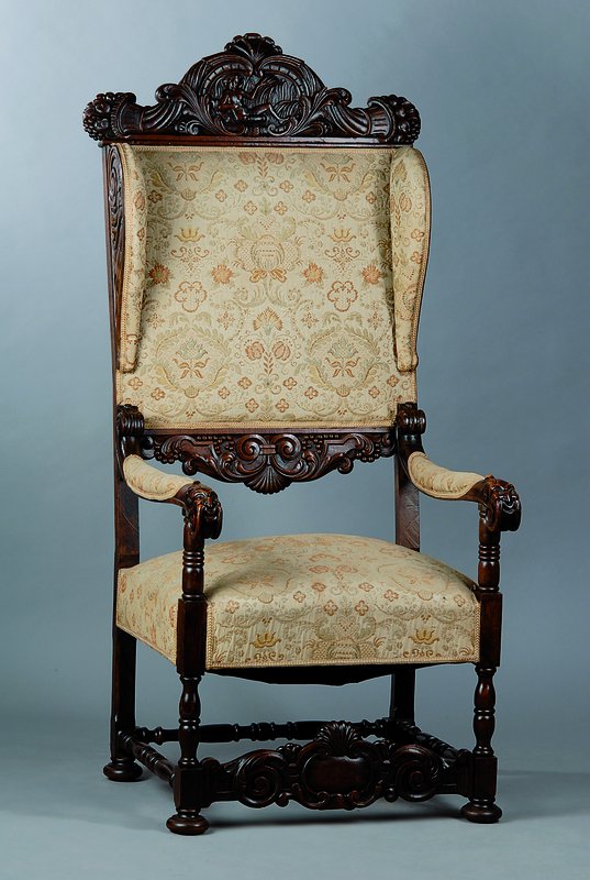 Ohrenbackensessel, um 1870/80, Nußbaum, Rücken und Sitzfläche mit Bezug und Polsterung, diese alt belassen, reiche Akanthusblattschnitzerei, ...