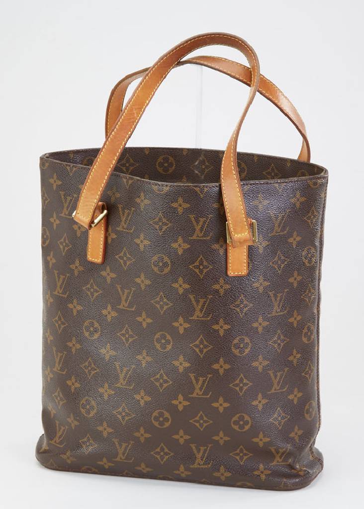 LOUIS VUITTON Tasche, Monogram Canvas, 2 Tragehenkel aus Leder, Monturen aus verg. Messing, innen brauner Leinenstoff, Seiten- fächer und ...