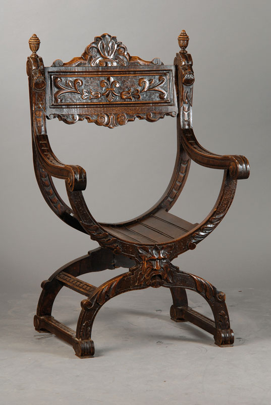Scherenstuhl, deutsch um 1870/80, Buche auf Nussbaum gebeizt, reichlich Flachschnitzerei u.a. in Akanthusblattform, mittig mit Fratze, sehr ...
